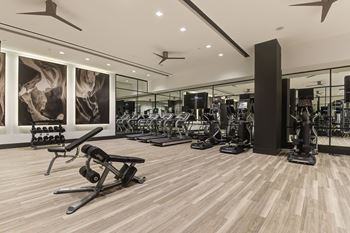 24/7 Fitness center with peloton bikes